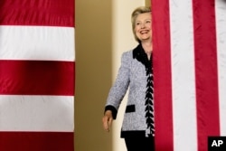 Democratic presidential candidate Hillary Clinton arrives to speak at a rally at the International Brotherhood of Electrical Workers Circuit Center in Pittsburgh, Tuesday, June 14, 2016. (AP Photo/Andrew Harnik)