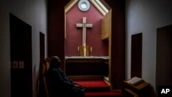 Arch Deacon Sepadi Moruthane inside Anglican Archbishop Emeritus Desmond Tutu's private chapel at the Soweto home. Wednesday, Dec. 29, 2021. (AP Photo