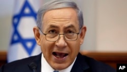Israeli Prime Minister Benjamin Netanyahu chairs the weekly Cabinet meeting at his office in Jerusalem, June 14, 2015. 