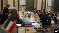 Kuwait's Emir Sheikh Sabah al-Ahmad Al-Sabah reads a statement during the opening session of the 23rd Arab League summit in Baghdad, Iraq, March 29, 2012. 