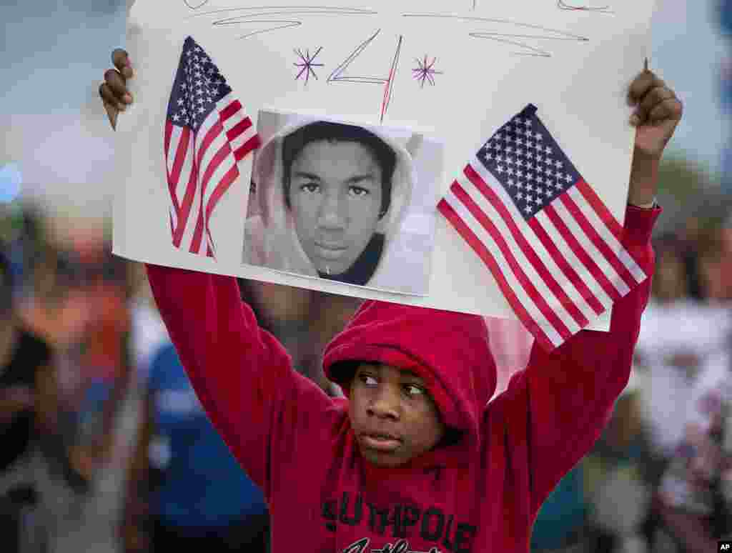 Jaylen Reese, 12, of Atlanta, marches during a protest of George Zimmerman's not guilty verdict in the 2012 shooting death of teenager Trayvon Martin, Atlanta, Georgia, July 15, 2013. 