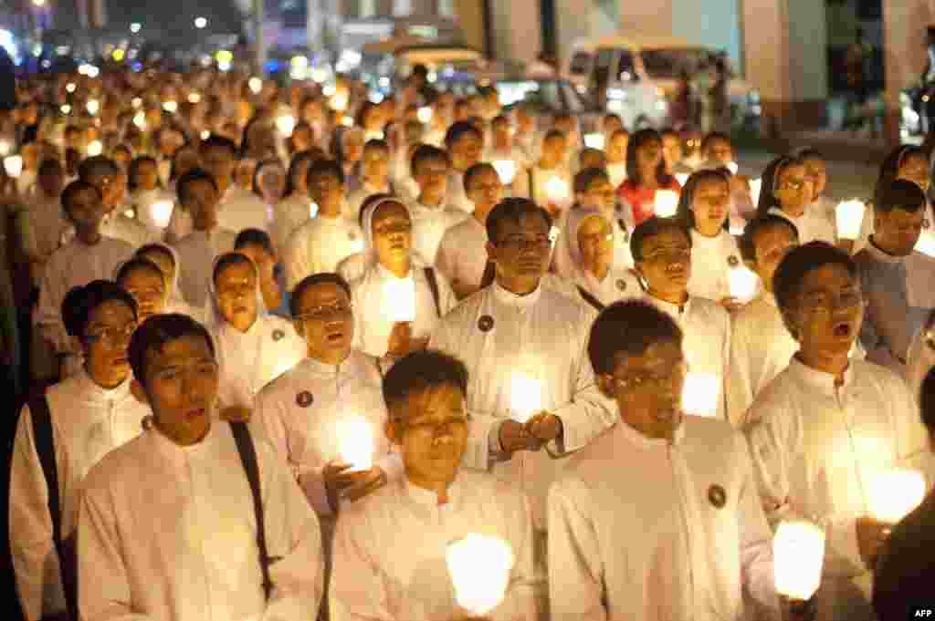 Myanmar Catholic nuns and priests hold candles as they gather for the 500th Jubilee Year of the presence of the Catholic Church in Myanmar, in Yangon.