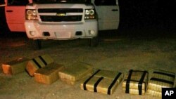 FILE - U.S. Customs and Border Protection displays an intercepted shipment of drugs that was brought into the U.S. from Mexico, near Yuma, Arizona.