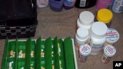 Tamika Taylor Jackson, who is HIV-positive, took this picture of the 17 pills she must take each day.
