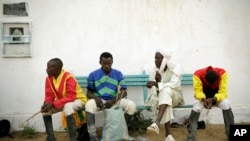 FILE - Jockeys wait during an afternoon of races at the hippodrome in N'djamena, Chad, March 15, 2015. Mali's stadium in Bamako recently reopened its horse races after closing for 8 months due to the coronavirus pandemic.