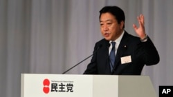 Finance Minister Yoshihiko Noda gives a speech shortly after he was elected as the new leader of the Democratic Party of Japan, August 29, 2011
