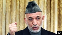 Afghan President Hamid Karzai speaks during a press conference in Kabul, February 08, 2011