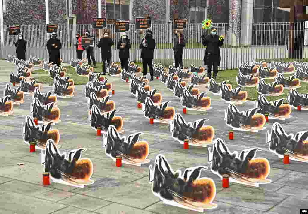 Environmental activists of Campact group put on a protest with 200 oversized cardboard bees, in front of the Chancellery in Berlin, Germany, to call for more insect protection.