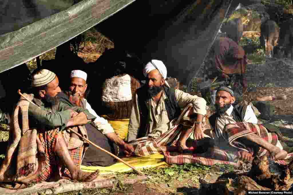 Dhumman (far right) and Yusuf (2nd from left) meet with other Van Gujjars to figure out the best strategy to move into the mountains and avoid trouble with forest rangers.
