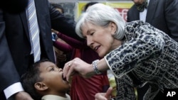 U.S. Health and Human Services Secretary Kathleen Sebelius administers polio vaccine to a child in New Delhi, India, January 13, 2012.