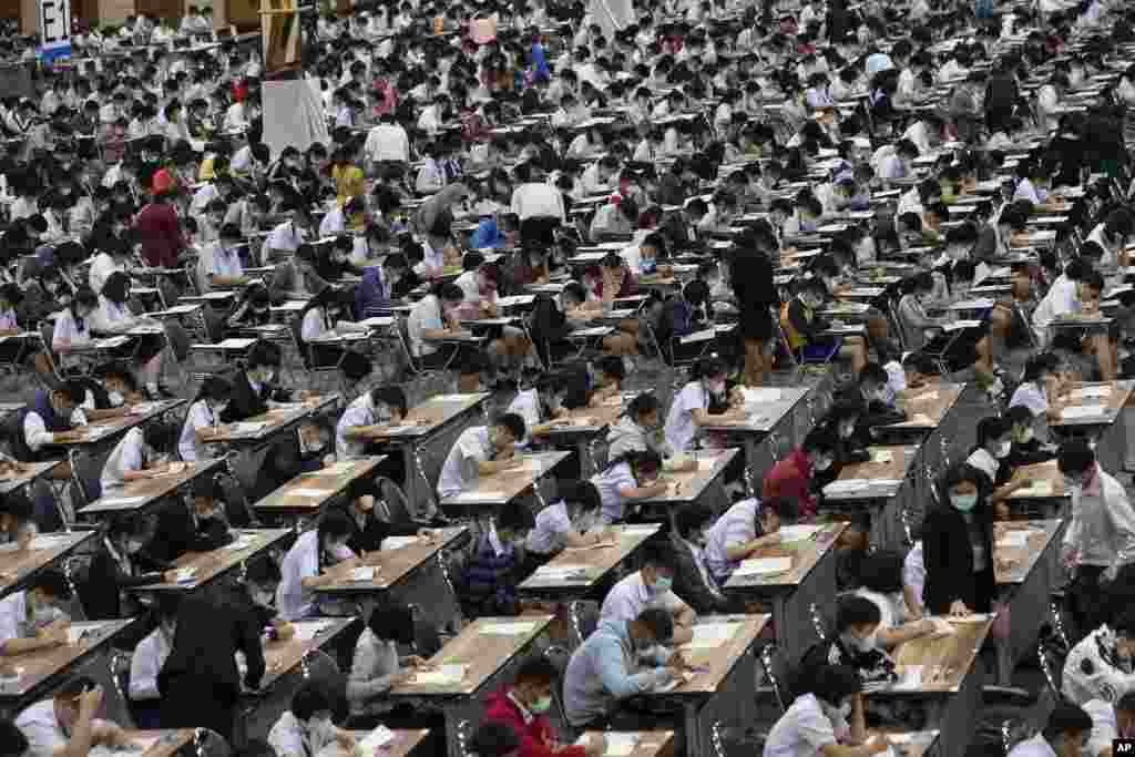Middle school students wear protective masks as they take an entrance examination for high school in Bangkok, Thailand.