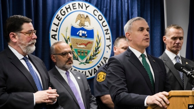 United States Attorney Scott Brady, at podium, speaks with members of the media during a news conference in the aftermath of a deadly shooting at the Tree of Life Synagogue in Pittsburgh, Oct. 28, 2018.