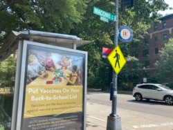 An advertisement promoting vaccinations in schools at a bus stop in Washington, D.C. July 26, 2021. (Dan Novak)