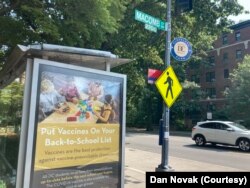 An advertisement promoting vaccinations in schools at a bus stop in Washington, D.C. July 26, 2021. (Dan Novak)