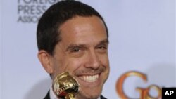 Director Lee Unkrich poses with the trophy he won for Best Animated Feature Film for his film "Toy Story 3," at the Golden Globe Awards Sunday, Jan. 16, 2011, in Beverly Hills, California