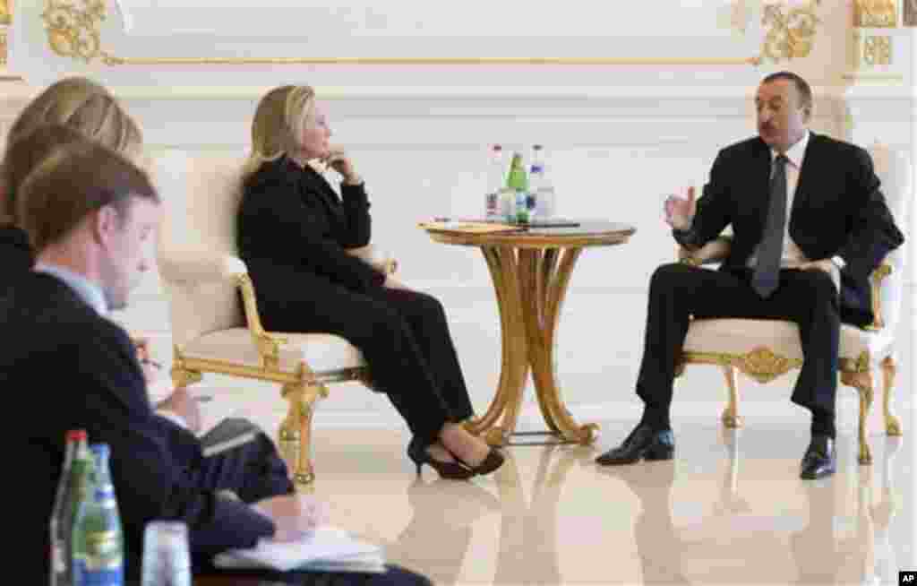 Azeri President Ilham Aliyev, right, and US Secretary of State Hillary Rodham Clinton meet at the presidential Zagulba residence in Baku, Azerbaijan on Wednesday June 6, 2012. Clinton has embarked on a tour of the South Caucasus in the hope of mediating p
