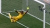Nigeria's goalkeeper Vincent Enyeama seems to defy gravity in the net for Nigeria at the Brasilia national stadium in Brasilia, June 30, 2014.