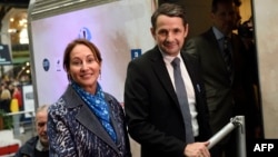 French Environment Minister Segolene Royal and Junior Minister for State Reform Thierry Mandon attend the inauguration of the "train du climat" (climate train) in Paris, Oct. 6, 2015.