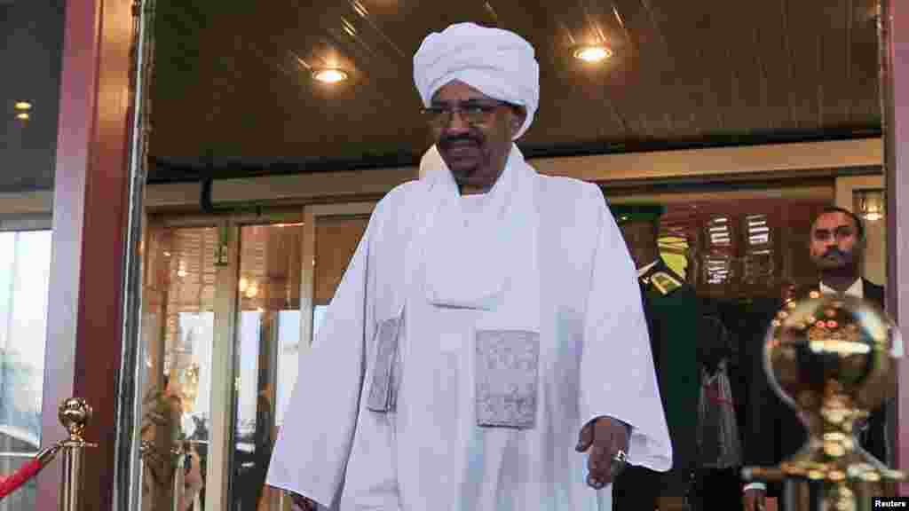 Sudanese President Omar al-Bashir walks out of a hotel in Abuja.