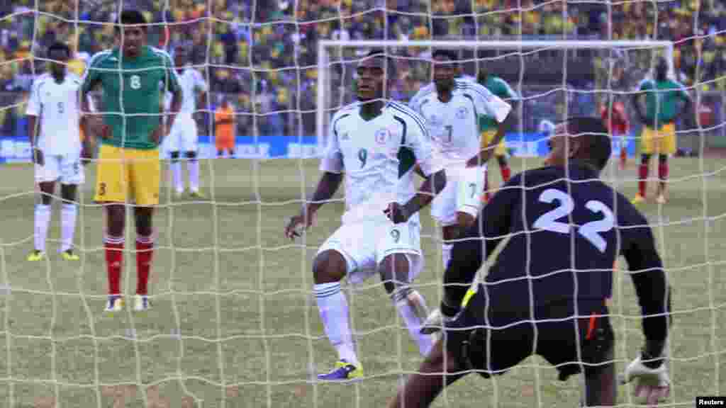 Nigeria's Emmanuel Emenike (9) scores past Ethiopia goalkeeper Jemal Tasew during their 2014 World Cup qualifying match.