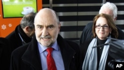 Herman Nackaerts, center, Deputy Director General and Head of the Department of Safeguards of the International Atomic Energy Agency, IAEA, is interviewed as he arrives after his flight from Iran at Vienna's Schwechat airport, Austria, February 22, 2012.