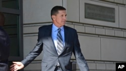 Former Trump national security adviser Michael Flynn leaves federal court in Washington, Friday, Dec. 1, 2017. Flynn pleaded guilty Friday to making false statements to the FBI, the first Trump White House official to make a guilty plea so far in a wide-ranging investigation led by special counsel Robert Mueller. (AP Photo/Susan Walsh)