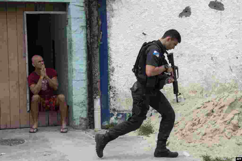 Military Police officers stage an operation at "Cidade de Deus" (City of God) favela in Rio de Janeiro, Brazil.