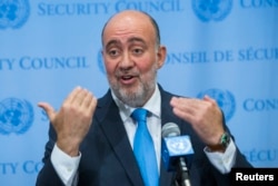 FILE - Israel's U.N. Ambassador Ron Prosor speaks to the media.
