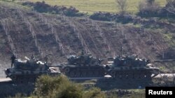 Turkish army tanks are seen near the Turkish-Syrian border in Kilis province, Turkey, Jan. 31, 2018. 