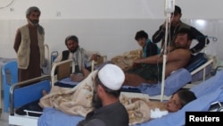 Afghans receive treatment at a hospital after Monday's airstrike in Kunduz province, Afghanistan, April 3, 2018.