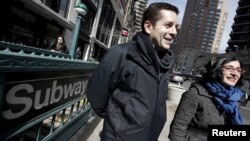 Comedians and makers of the documentary film "The Muslims are Coming" Dean Obeidallah (L) and Negin Farsad are pictured during an interview with Reuters outside a subway station in the Manhattan borough of New York City, March 7, 2016.