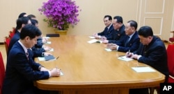 In this photo provided by South Korea Presidential Blue House via Yonhap News Agency, Kim Yong Chol, vice chairman of North Korea's ruling Workers' Party Central Committee, second from right, talks with South Korean delegation in Pyongyang, North Korea.