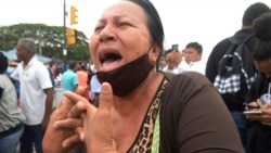 Relative of Litoral penitentiary inmate demands information about their fate the morning after riots broke out inside the jail in Guayaquil, Ecuador, Nov. 13, 2021.