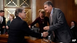 Energy Secretary Rick Perry, left, speaks with Sen. Joe Manchin, D-W.Va., right, ranking member of the Senate Energy and Natural Resources Committee, and committee chairwoman, Sen. Lisa Murkowski, R-Alaska, before testifying April 2, 2019, on Capitol Hill.