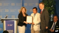 Sok Khemara, VOA Khmer staff (middle) receives David Burke Distinguished Journalism Awards, an annual award presented by the Broadcasting Board of Governors.