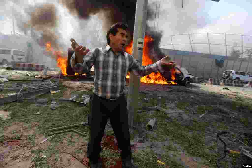 An Afghan man reacts at the site of a blast in Kabul, Afghanistan, May 31, 2017.