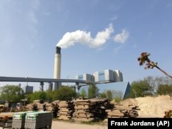 A chimney billows out steam at Berlin's Reuter West thermal power station on Wednesday, April 24, 2019. The energy company, together with a Swedish start-up, is testing the use of salt to store heat, which accounts for more than half the power consumed in