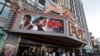 FILE - Moviegoers arrive at the Fox Theatre for the premiere of "Detroit" in Detroit, July 25, 2017. 