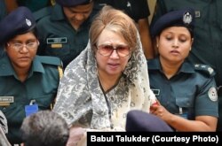 FILE - Former Prime Minister Khaleda Zia, chairperson of Bangladesh's largest opposition party of BNP, is being taken to a hospital in Dhaka from her jail for certain medical tests, Apr. 7, 2018.
