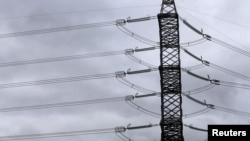 FILE - Overhead power lines of the Estonian power distribution company Elering are pictured in Tallinn, Estonia, Sept. 30, 2015. Baltic states are looking to synchronize their electricity grids away from Russia.