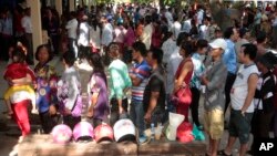 FILE PHOTO - Cambodian residents line up to vote in local elections at a polling station in Chak Angre Leu on the outskirts of Phnom Penh, Cambodia, Sunday, June 4, 2017. 