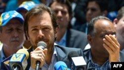 FILE - Chacao's Mayor Ramon Muchacho speaks next to other opposition mayor during a press conference at the Bolivar square in the Chacao neighborhood in Caracas, on May 25, 2017.