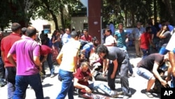 Feridos na explosão, Suruc, Turquia.