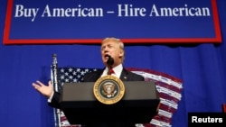 U.S. President Donald Trump speaks before signing an executive order directing federal agencies to recommend changes to a temporary visa program used to bring foreign workers to the United States to fill high-skilled jobs during a visit to Snap-On Inc., a tool manufacturer, in Kenosha, Wisconsin, April 18, 2017. 
