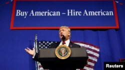 U.S. President Donald Trump speaks before signing an executive order directing federal agencies to recommend changes to a temporary visa program used to bring foreign workers to the United States to fill high-skilled jobs during a visit to Snap-On Inc., a