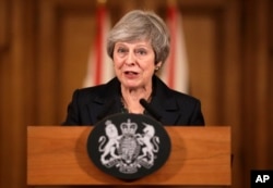 Britain's Prime Minister Theresa May speaks during a press conference inside 10 Downing Street in London, Nov. 15, 2018.