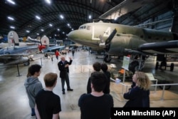 In this Friday, April 26, 2019 photo, visitors browse the D-Day displays at the The National Museum of the U.S. Air Force, in Dayton, Ohio.