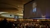 Projection screens show President Barack Obama speaking at the 62nd National Prayer Breakfast in Washington D.C., Feb. 6, 2014. 