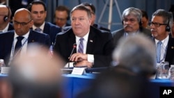 U.S. Secretary of State Mike Pompeo, center, attends a session of the General Assembly of the Organization of American States (OAS), June 4, 2018, in Washington.