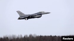 FILE - A F-16 fighter from the U.S. Air Force 510th Fighter Squadron is seen taking off at Amari air base, Estonia, March 26, 2015.